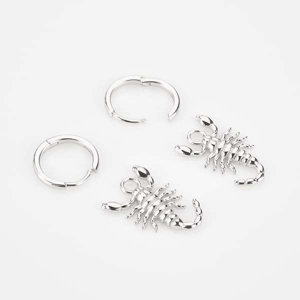 Silver scorpion hoop earrings details