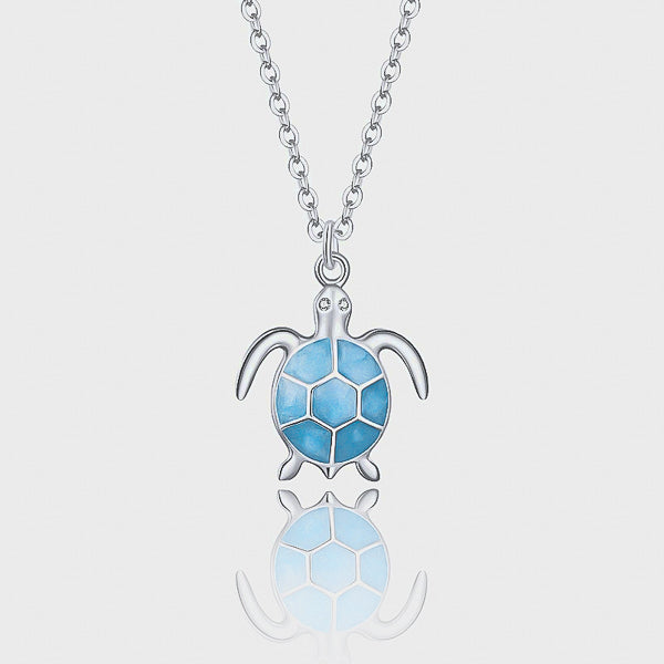 Blue sea turtle pendant on a silver necklace details