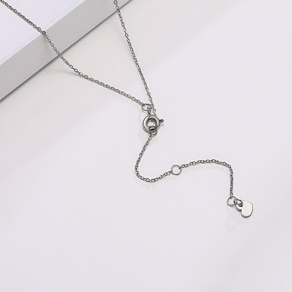 Silver sideways cross necklace display