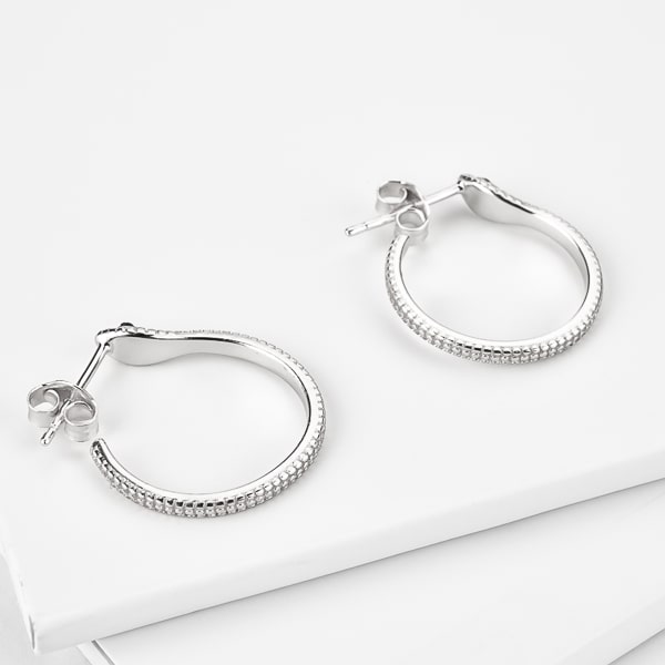 Silver snake hoop earrings detail