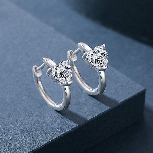 Silver cubic zirconia heart huggie hoop earrings details