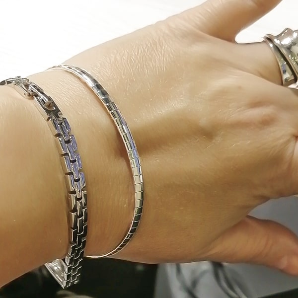 Silver square chain bracelet displayed on a woman's wrist