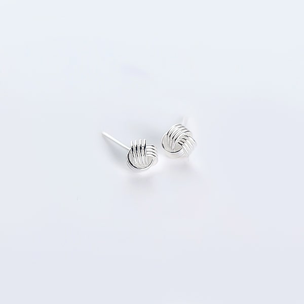 Silver triple knot stud earrings detail
