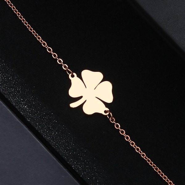 Simple rose gold lucky bracelet with a four-leaf clover charm