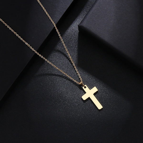 Simple gold cross pendant necklace display