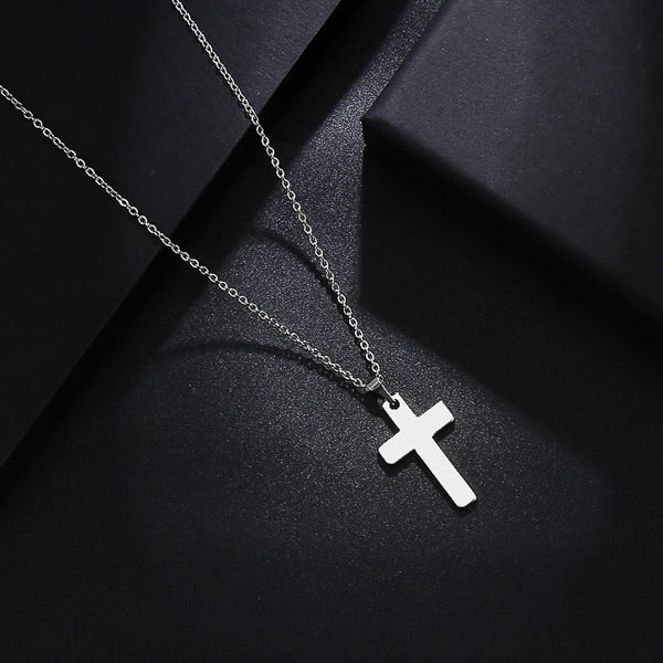 Simple silver cross pendant necklace display