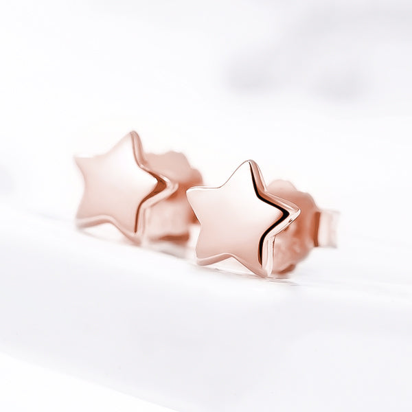 Small rose gold star stud earrings details