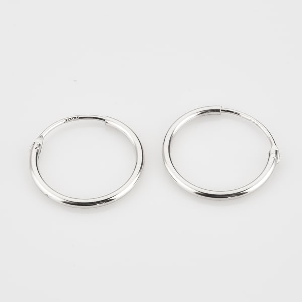 Small thin silver hoop earrings detail