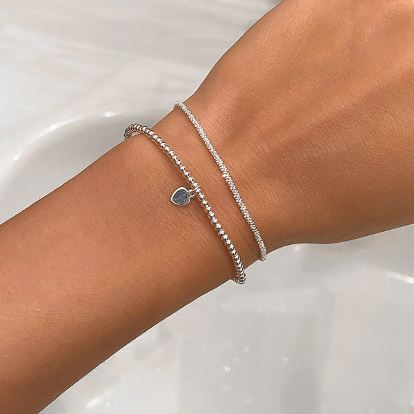 Sparkling sterling silver chain bracelet on woman's wrist