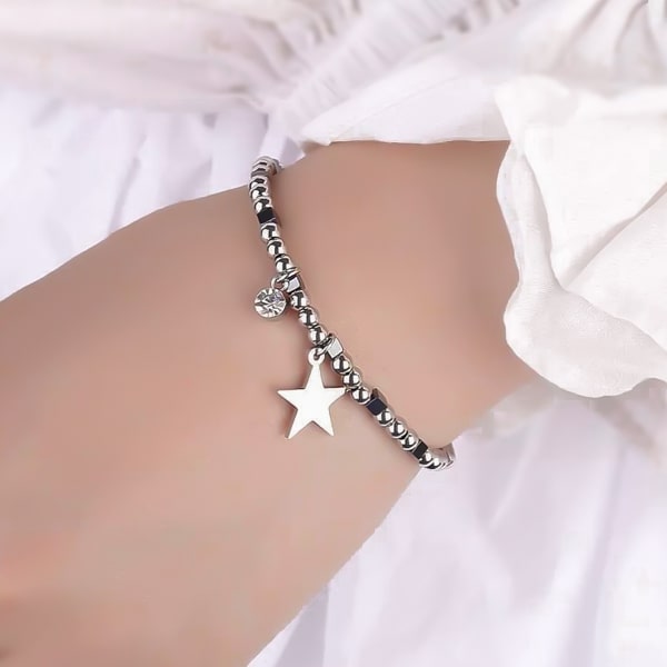 Woman wearing a star bracelet on her wrist