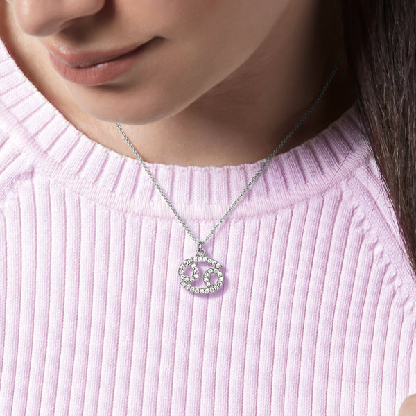 Woman wearing a sterling silver Cancer necklace
