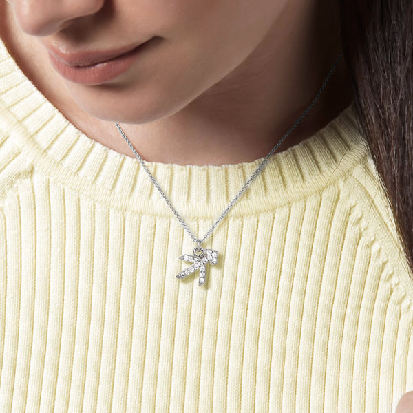 Woman wearing a sterling silver Sagittarius necklace