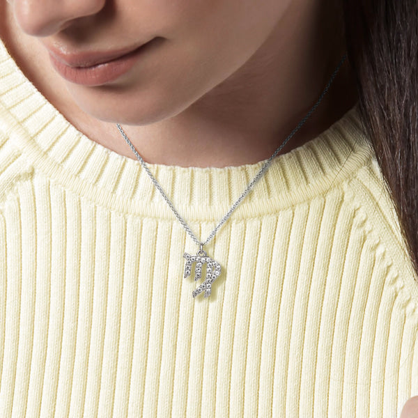 Woman wearing a sterling silver Virgo necklace