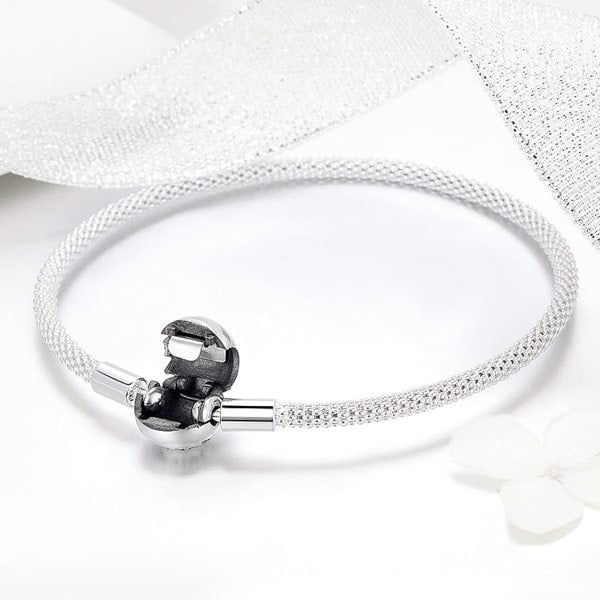 Sterling silver ball clasp bangle bracelet displayed with an open lock
