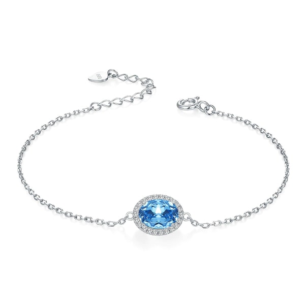 Sterling silver bracelet with a blue oval cut topaz