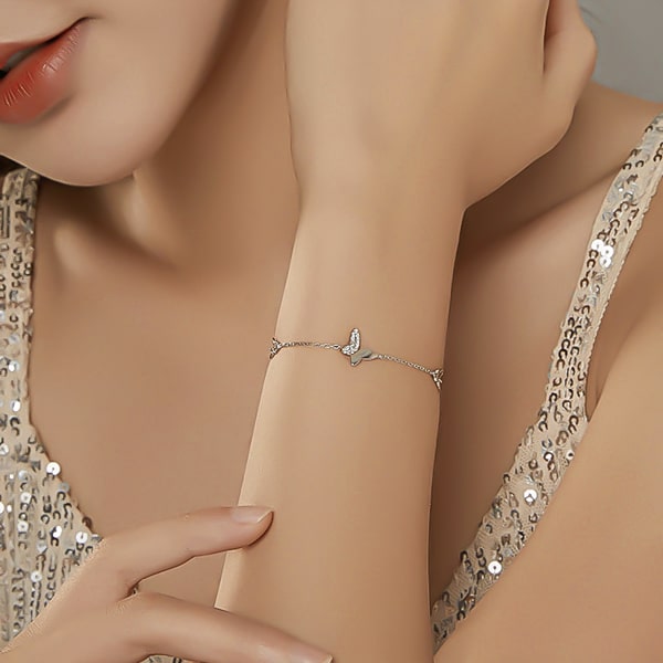 Sterling silver butterfly bracelet on a woman's wrist