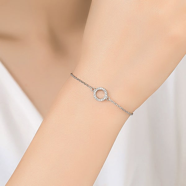 Sterling silver crystal hoop bracelet on a woman's wrist