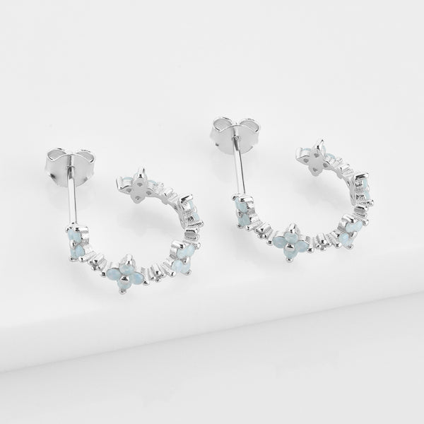 Silver floral hoop earrings details