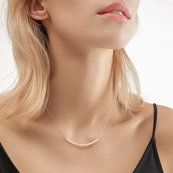 Woman wearing a sterling silver freshwater pearls necklace