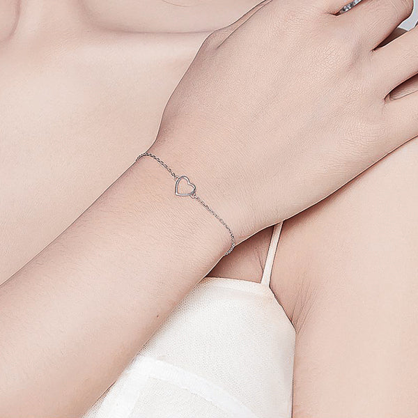 Sterling silver heart bracelet on woman's wrist