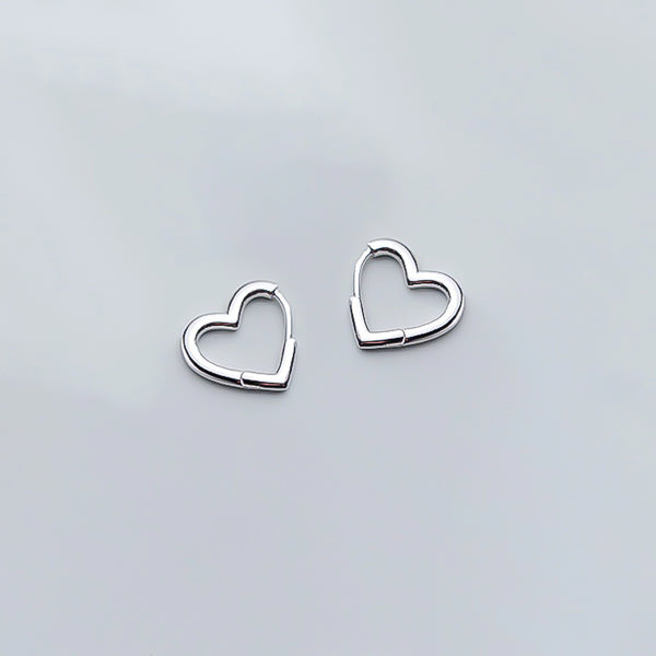 Silver heart huggie hoop earrings details