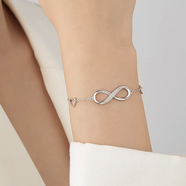 Sterling silver infinity bracelet displayed on a woman's arm