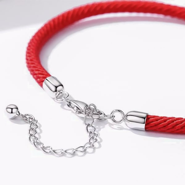 Simple red rope bracelet with a sterling silver lock close up