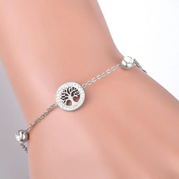 Sterling silver tree of life chain bracelet on a woman's wrist
