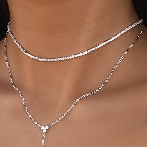 Woman wearing a silver tennis choker necklace