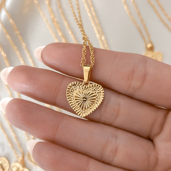 The textured backside of the two-sided heart pendant necklace