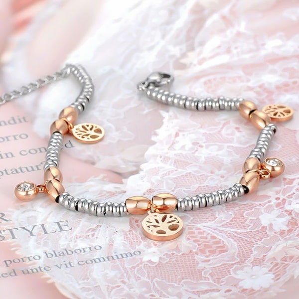 Tree of life charm bracelet in silver and rose gold detailed close up