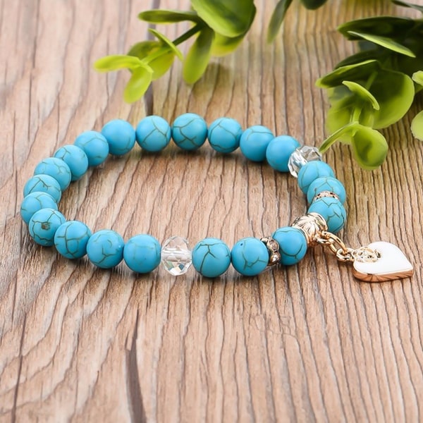 Turquoise natural stone bracelet with a gold heart charm
