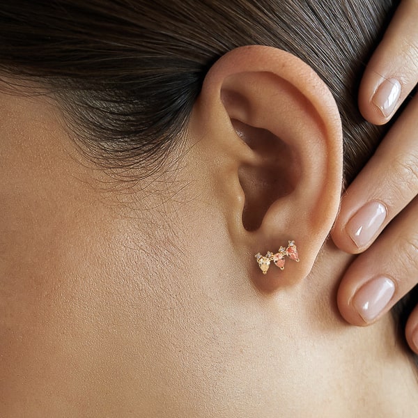Model wearing vivid triple pear crystal stud earrings