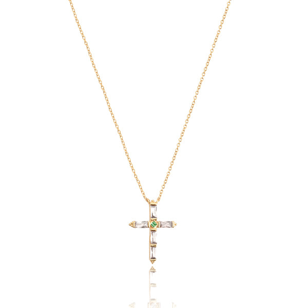 White crystal cross on a gold necklace