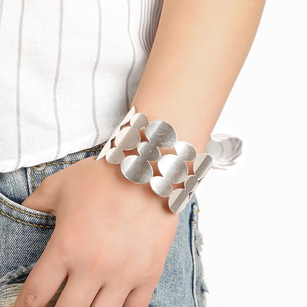 Woman wearing a silver geometric cuff bracelet
